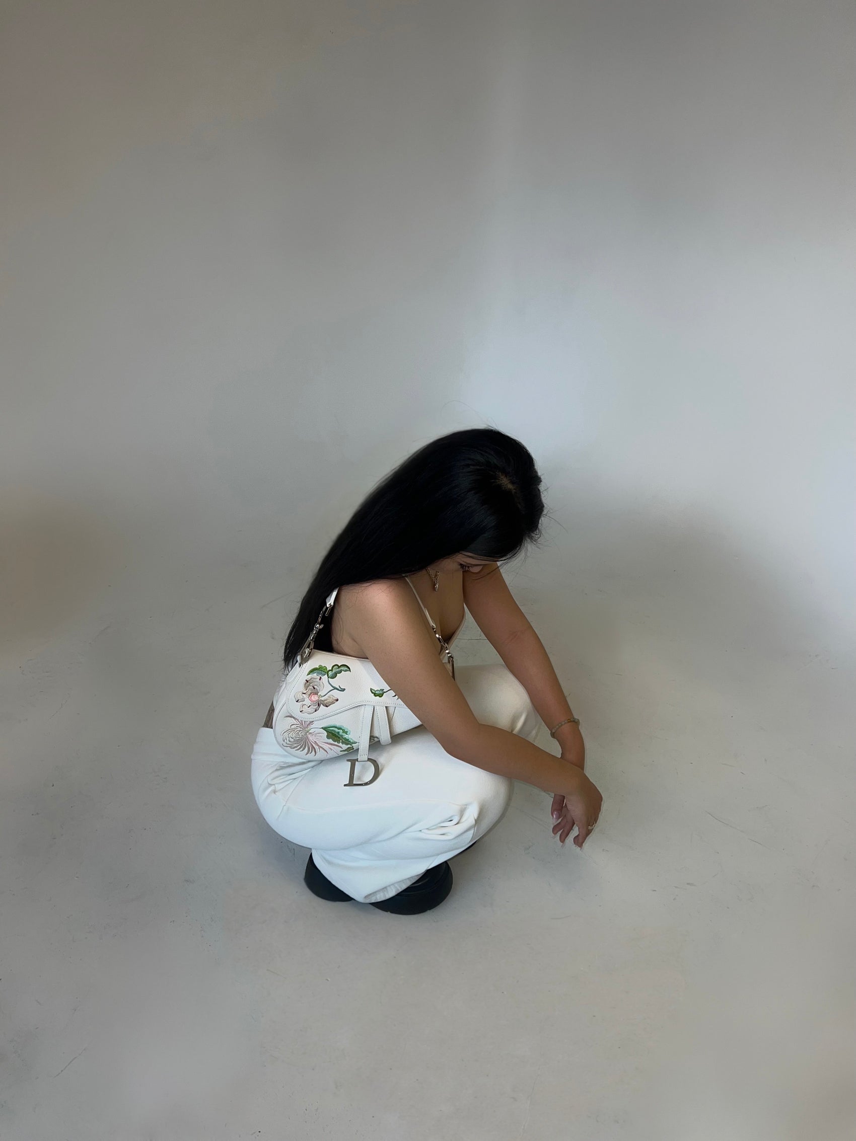 Girl in white dior saddle bag